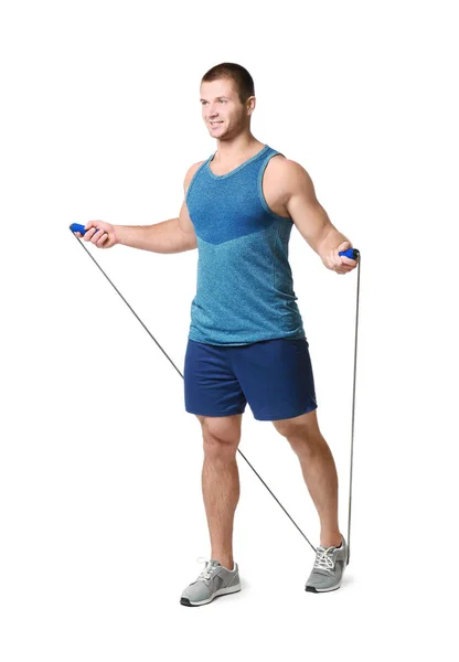 Young man with jumping rope on white background — Stock Photo, Image