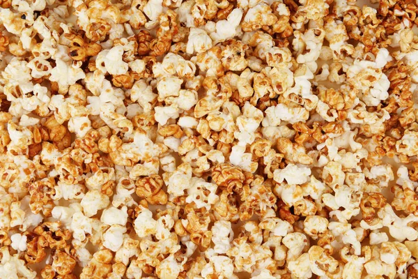 Heerlijke caramel popcorn als achtergrond — Stockfoto