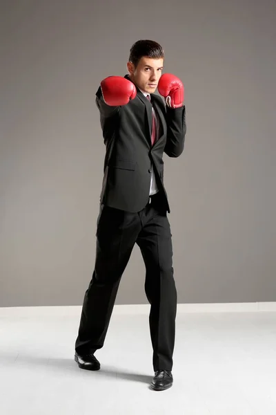 Businessman in boxing gloves — Stock Photo, Image