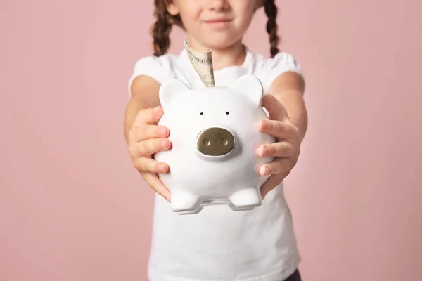 Little girl with piggy bank — Stock Photo, Image