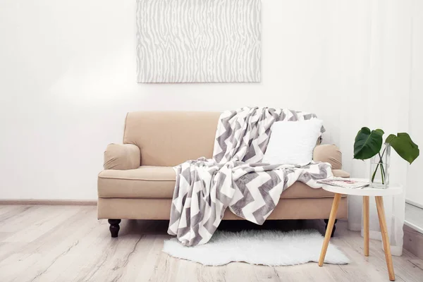 Comfortable sofa against wall — Stock Photo, Image