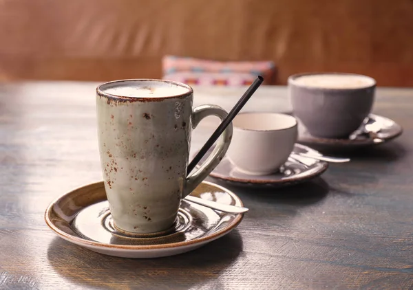 Cups of coffee on table — Stock Photo, Image