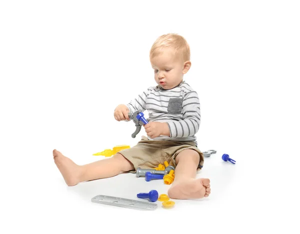 Schattige kleine baby met speelgoed, geïsoleerd op wit — Stockfoto