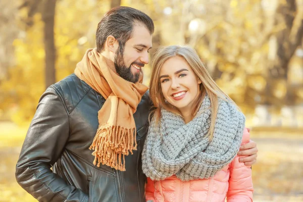 Young couple walking in park — Stock Photo, Image