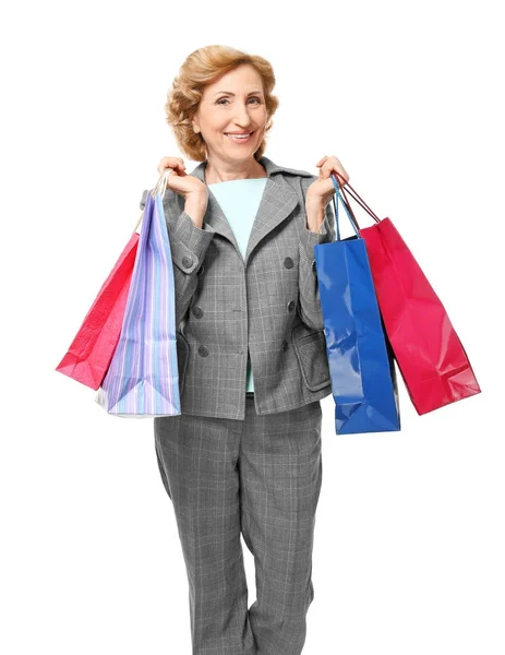 Mulher madura segurando sacos de compras — Fotografia de Stock