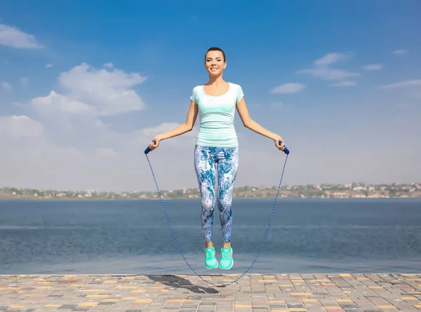 Young woman with jumping rope