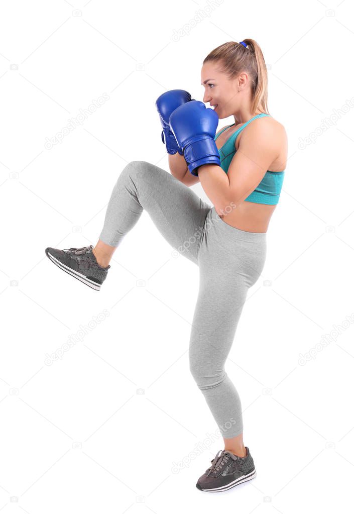 Female kickboxer on white background