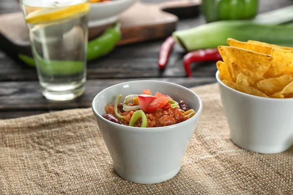 Bowl with chili con carne on table — Stock Photo, Image