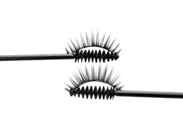 Mascara brushes and false eyelashes — Stock Photo, Image