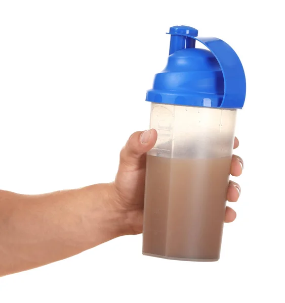 Protein içeceği beyaz arka plan üzerinde tutan genç adam — Stok fotoğraf