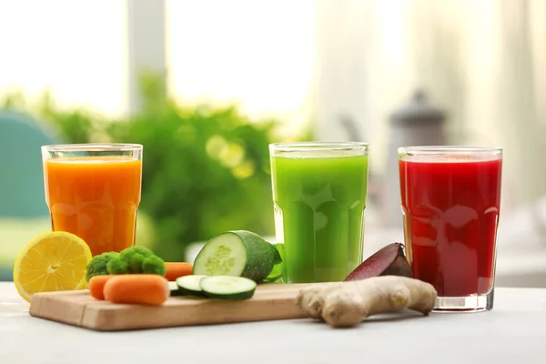 Glasses with various fresh vegetable juices — Stock Photo, Image