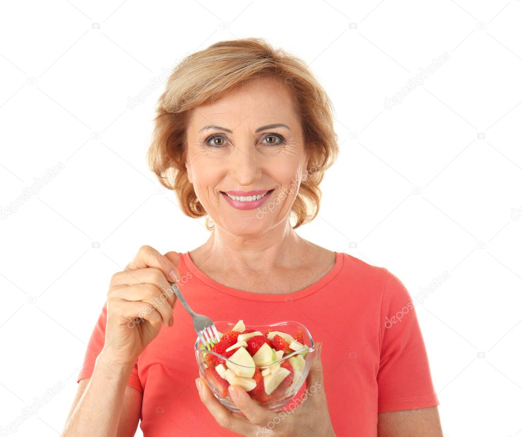 woman with bowl of fruit salad