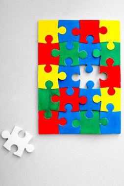 Color puzzles on light background clipart