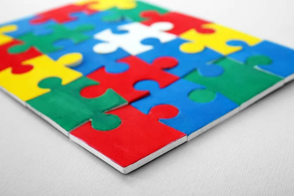 Color puzzle on light background — Stock Photo, Image