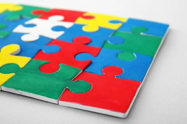 Color puzzle on light background — Stock Photo, Image