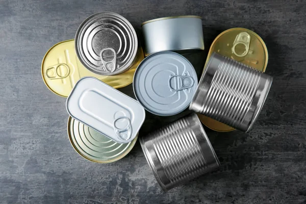 Tin cans on grey — Stock Photo, Image