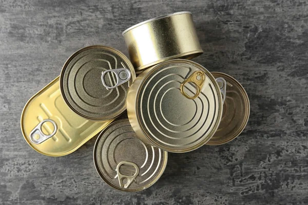 Tin cans on grey — Stock Photo, Image