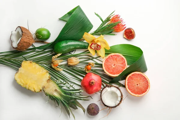 Tropical leaves and exotic fruits