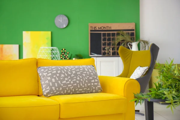 Bright yellow sofa in modern interior