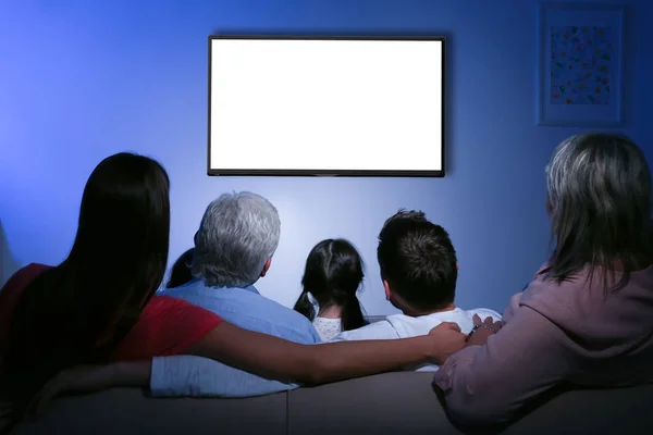 Family and blank TV display at home — Stock Photo, Image