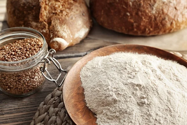 Plate with buckwheat flour — Stock Photo, Image