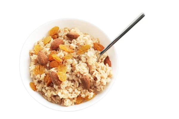 Tasty oatmeal with raisins and almond in bowl on white background — Stock Photo, Image