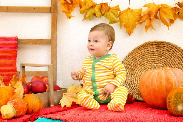 Entzückendes Baby im gestreiften Pyjama drinnen — Stockfoto