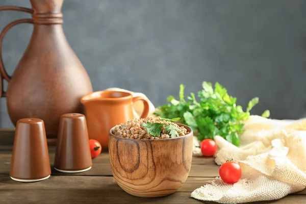 Wooden bowl with buckwheat porridge — Stock Photo, Image