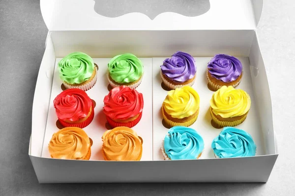 Box with tasty cupcakes — Stock Photo, Image