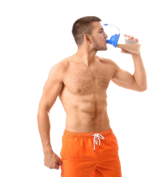 Schöner junger Mann mit Proteinshake — Stockfoto