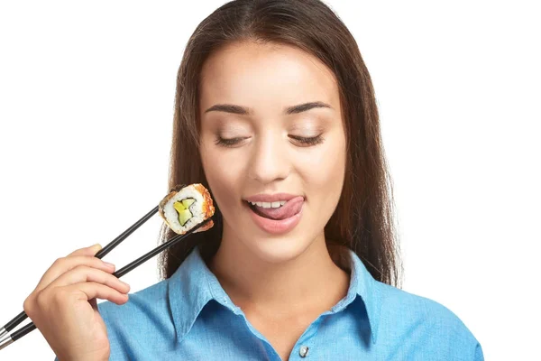 Beautiful young woman with sushi roll — Stock Photo, Image