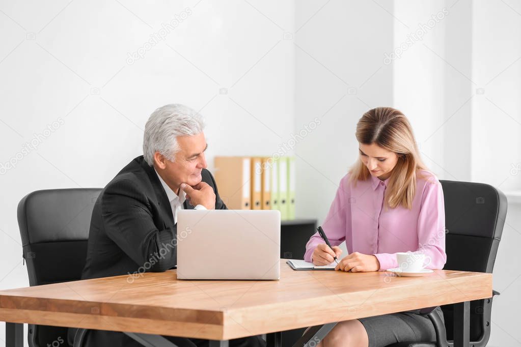 woman consulting elderly man 