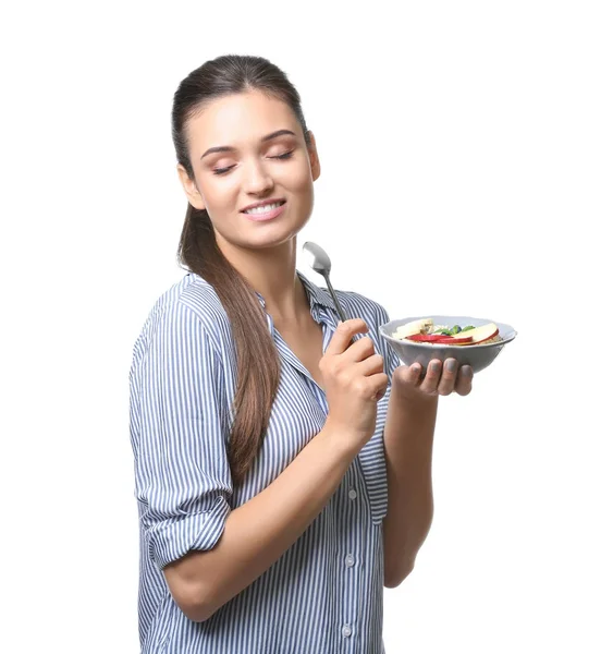 Giovane donna che mangia farina d'avena — Foto Stock