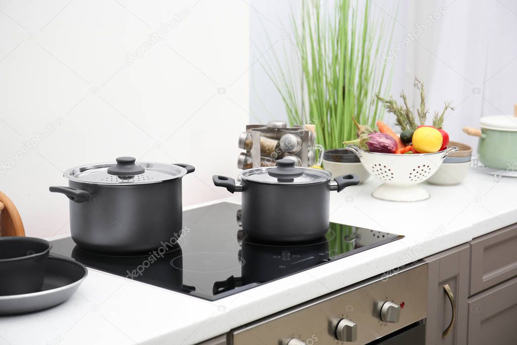 Cooking utensils on electric stove