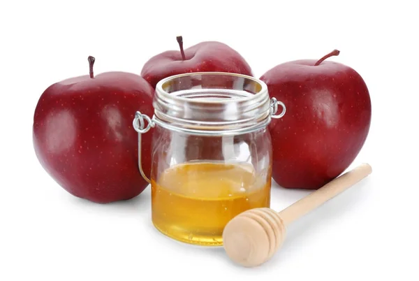 Manzanas rojas maduras y frasco de vidrio con miel —  Fotos de Stock