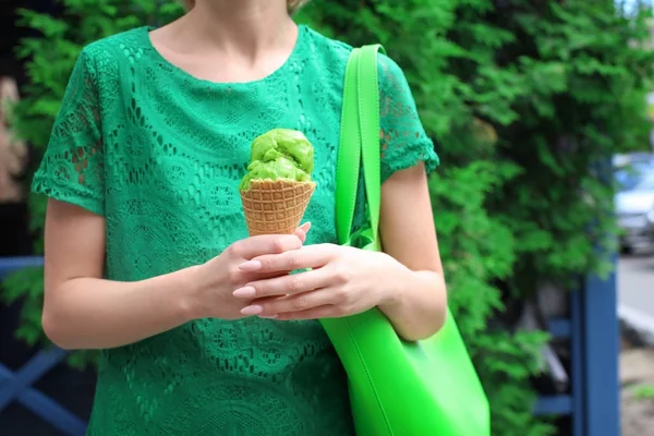 Hipster woman in green lace dress holding ice cream — Stock Photo, Image