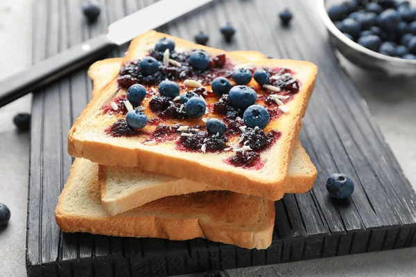 Tasty toasts and blueberries — Stock Photo, Image