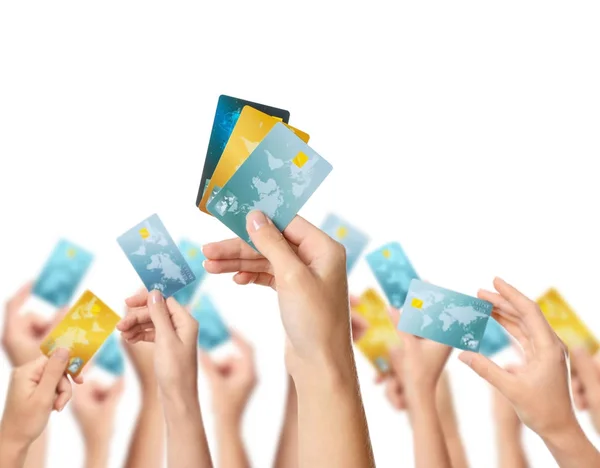 Women holding credit cards on white background — Stock Photo, Image