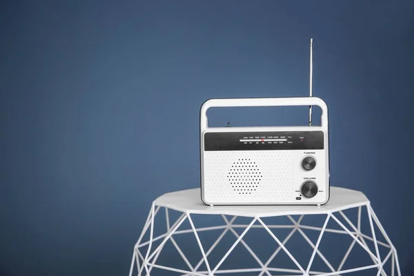 Stylish radio on color background