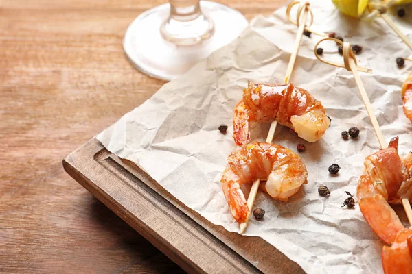 Shrimps wrapped in bacon — Stock Photo, Image