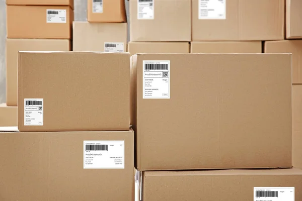 Parcels with tracking codes — Stock Photo, Image