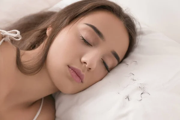 Sleeping woman and artificial eyelashes — Stock Photo, Image