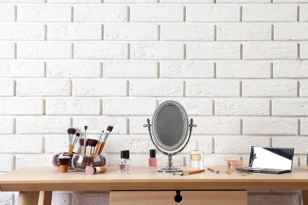 Mirror and cosmetics on table — Stock Photo, Image