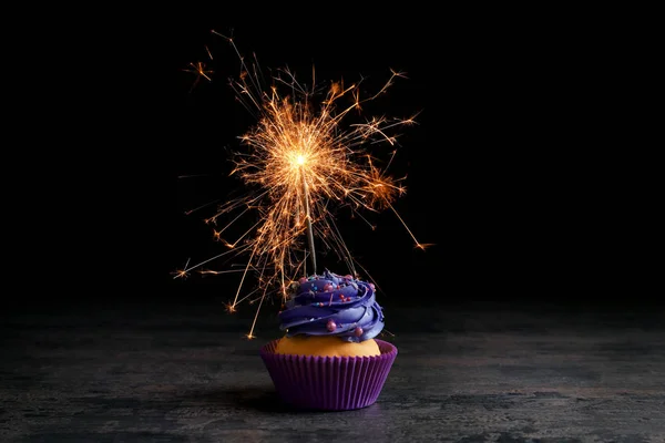 Tasty cupcake with Bengal fire — Stock Photo, Image