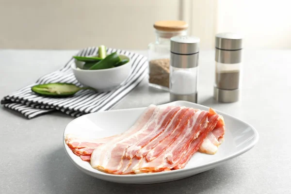 Plate with rashers of bacon — Stock Photo, Image