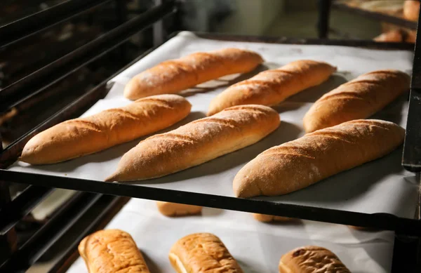 Loaves of bread on shelving — Stock Photo, Image