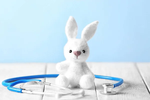 Toy bunny and stethoscope — Stock Photo, Image