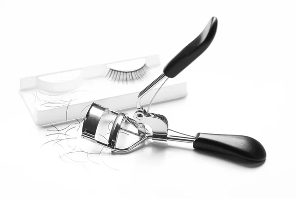 Curler and false eyelashes — Stock Photo, Image