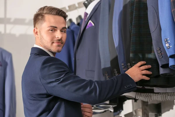 Man choosing suit — Stock Photo, Image