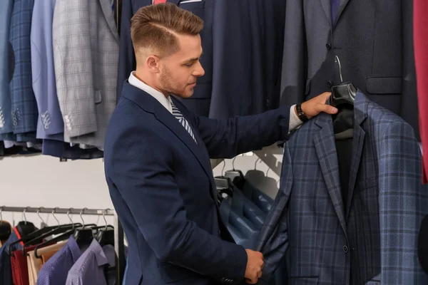 Man choosing suit — Stock Photo, Image